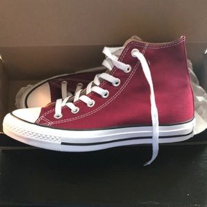 Maroon high top chuck taylor.